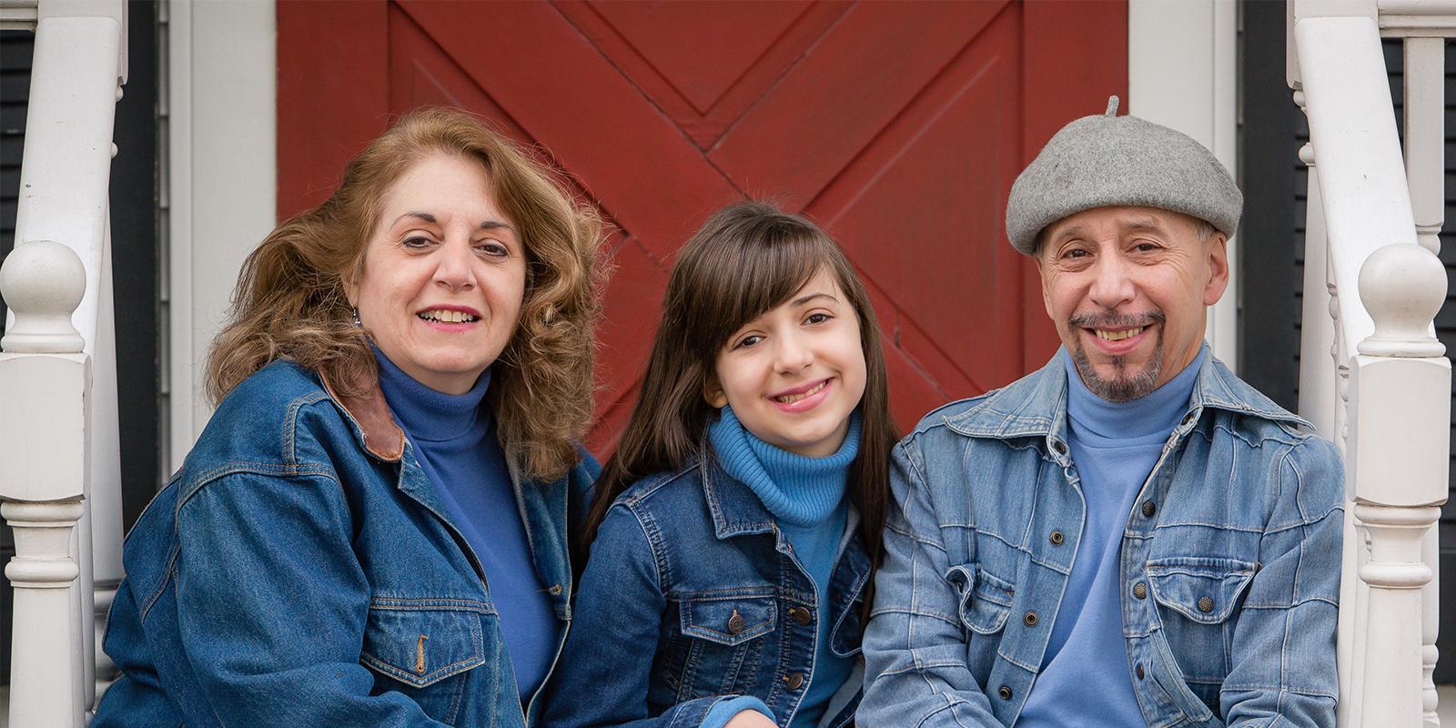 An image of parents and child smiling.